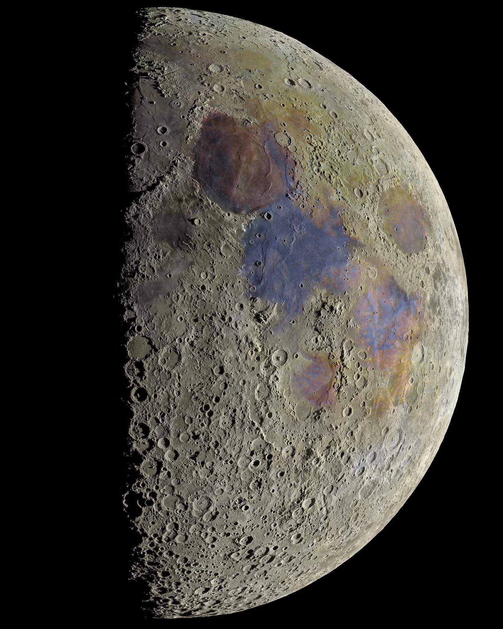 Extremely high res moon photo, with enhanced colours. The surface is pockmarked and traces of different elements are apparent across the surface.